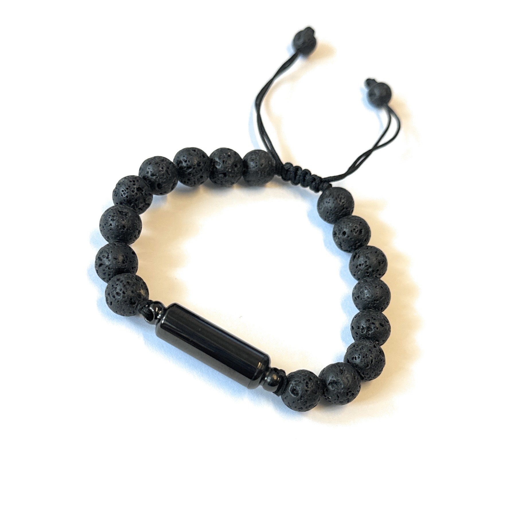 Black bracelet with hiding place / fillable capsule in lava stone look