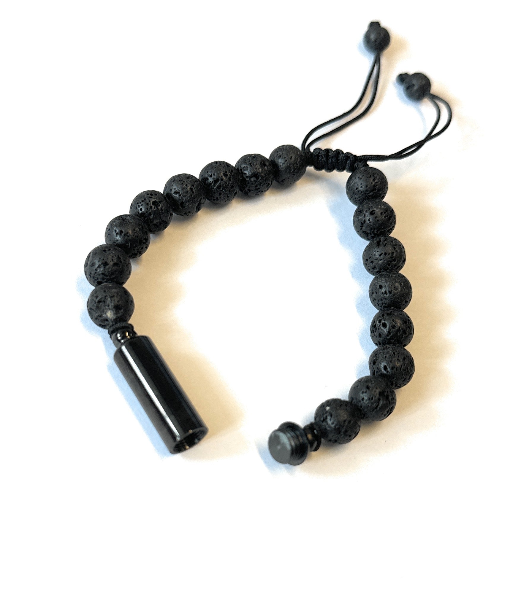 Black bracelet with hiding place / fillable capsule in lava stone look